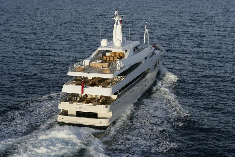 An aerial view forward over the foredeck sunpads and the bridge structure behind them.