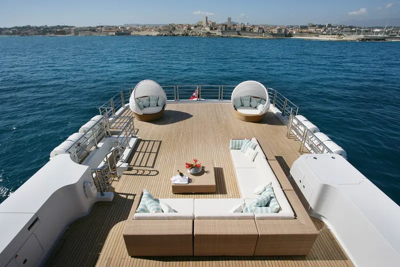 An overhead view of the stern deck and pool area, showing the layout of loungers around the plunge pool.