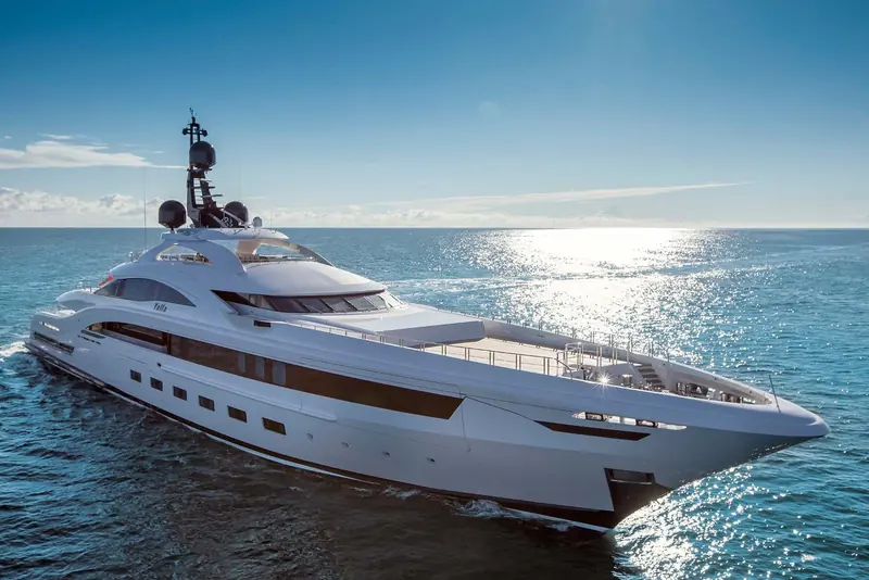 A bow-quarter view of Yalla at dusk, a different angle and lighting from her broadside twilight shot.