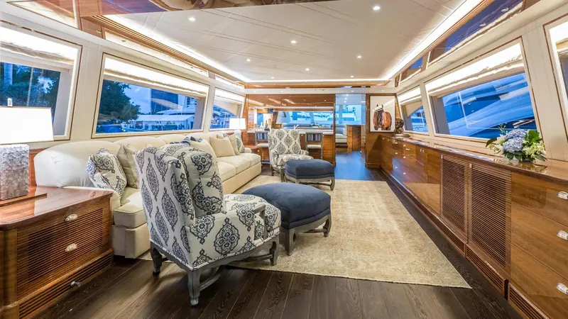 The main saloon, finished in traditional gloss-varnished wood rather than the painted-oak look more common on newer designs.
