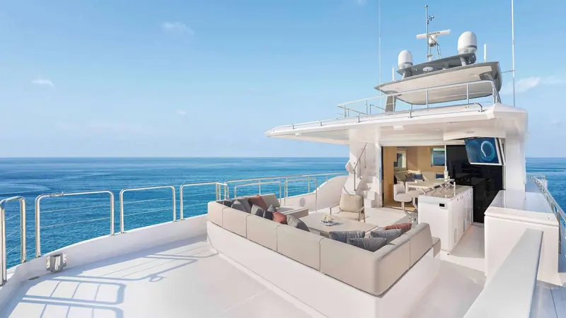 The upper deck lounge and open galley, arranged so the crew can serve without leaving the aft deck.