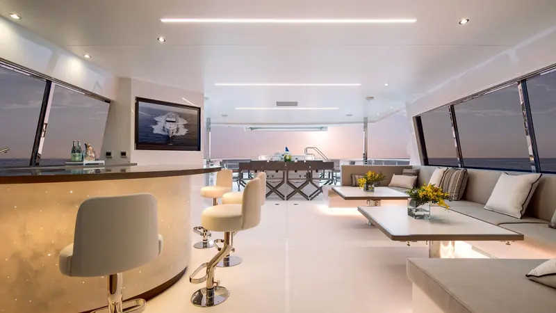The skylounge bar and seating, finished in warm oak with a full entertainment system built into the forward bulkhead.