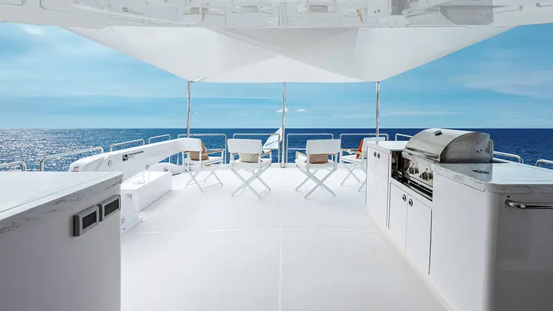The flybridge, laid out with a full outdoor galley and grill rather than just sunpads.
