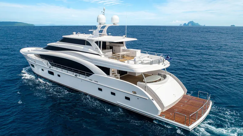 Stern quarter view showing the low aft platform and integrated swim step used for tender and water-toy launching.