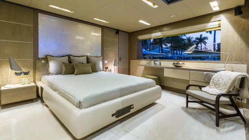 A guest stateroom with a private balcony view, one of the accommodation layouts the RP120 offers below the main deck.