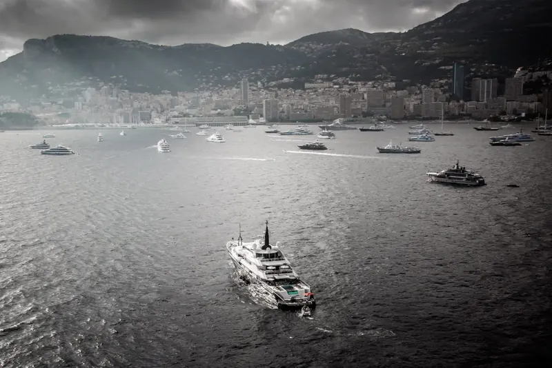 At anchor off Monaco, the harbour and the hills above La Condamine crowded with boats behind her.
