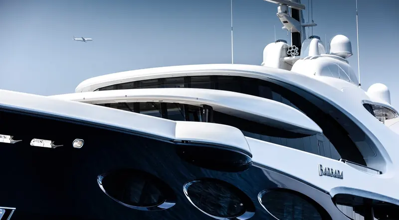 The bow's sculpted sheerline photographed close alongside, with the BARBARA lettering visible at the stem.