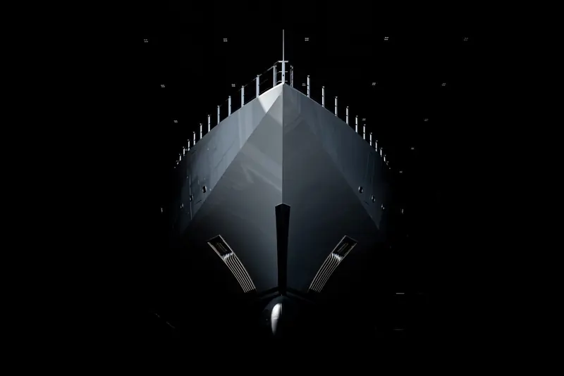 A near-silhouette study of the bow's angular, origami-like naval architecture.