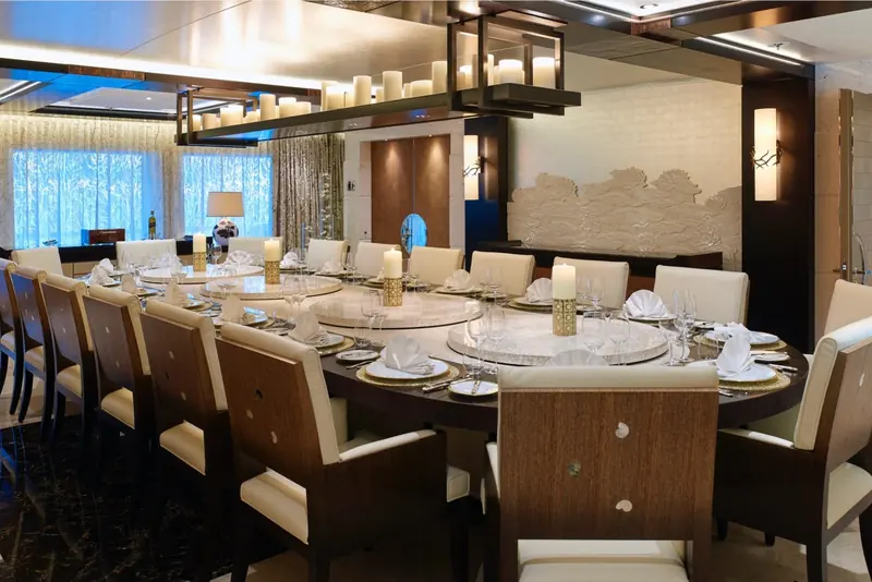 The formal dining room, seating up to sixteen around a marble table with a rotating lazy Susan centre.
