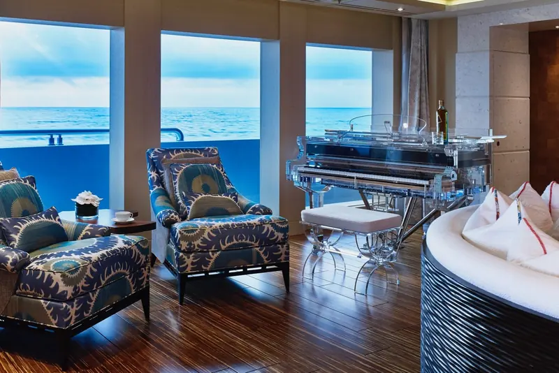 A sky lounge fitted with a transparent Lucite grand piano, one of several one-off pieces made for the yacht.