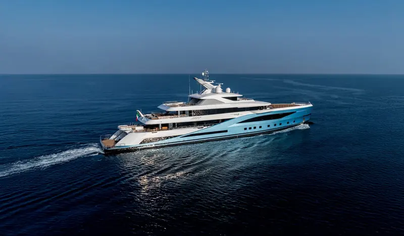 Amalya underway, an aerial view showing her blue-fade hull livery and full profile from above.