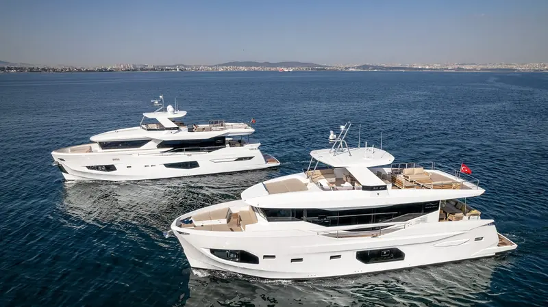 Two 22XP hulls running together off Istanbul, showing the flybridge hardtop and low reverse bow shared across the pair.