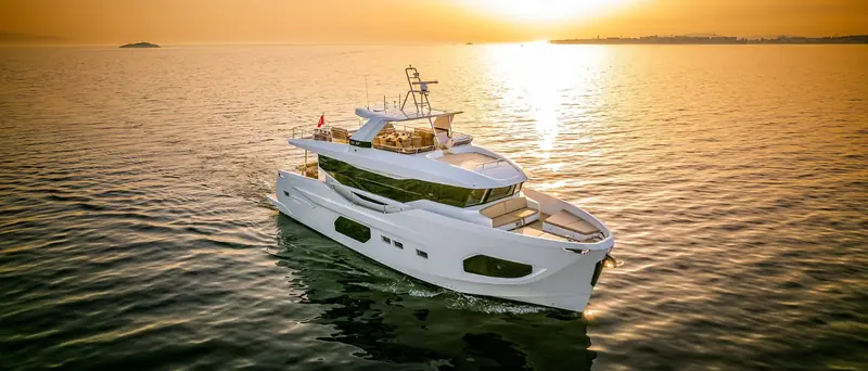 The sunset run showing the 22XP's full profile, hull windows and the low freeboard the range is built around.