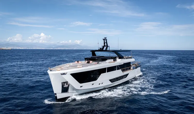 Hull Minella running off Antibes, the twin-deck explorer profile and raised pilot mast that mark Numarine's XP line.
