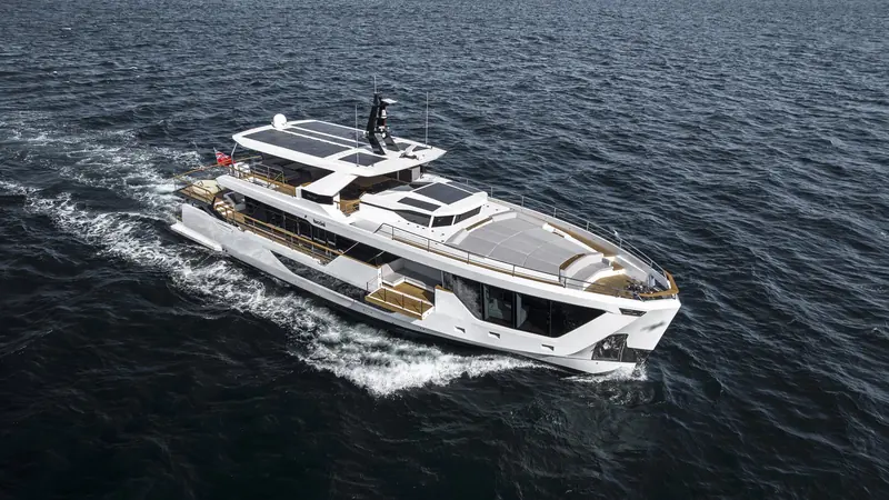 Underway with the flybridge hardtop's black solar array visible, part of the XP line's hybrid-power option.