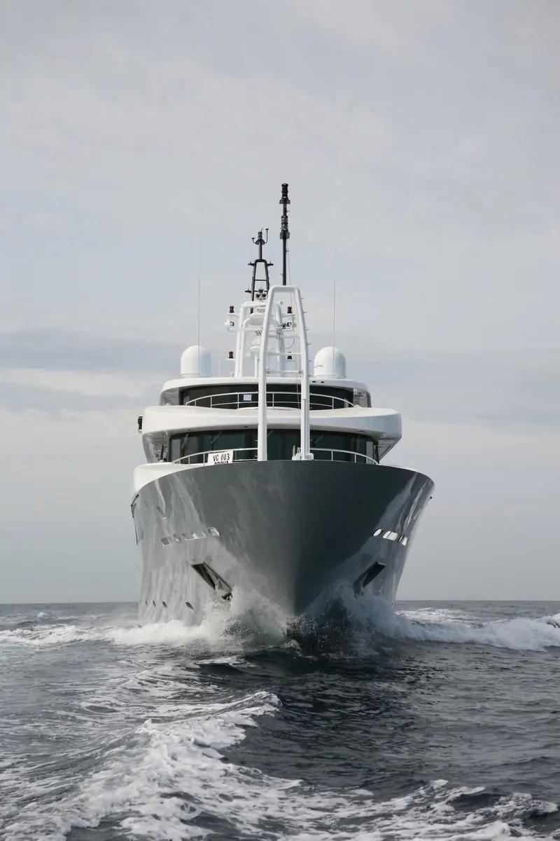 Head-on into a following sea, the flared bow and low sheer keep spray off the foredeck while the boat holds a cruising speed most explorer-style hulls can't match.