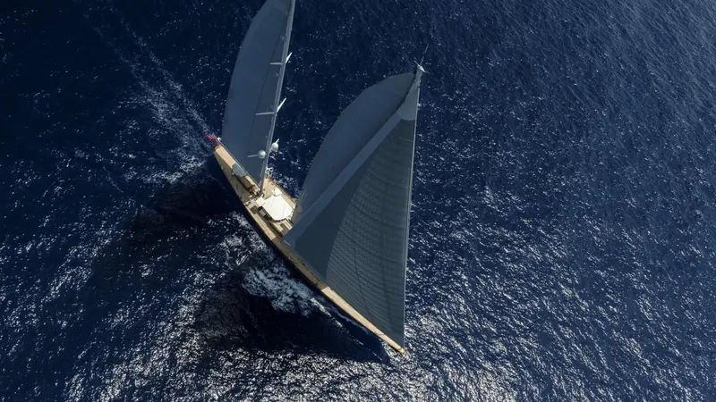 Aquarius from directly overhead under full sail, the classic long-keeled profile that marks her out from the flat-decked performance sloops built since.