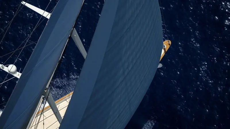 Looking up the headsails from the foredeck, the sailplan trimmed hard on a beat rather than posed for the camera.