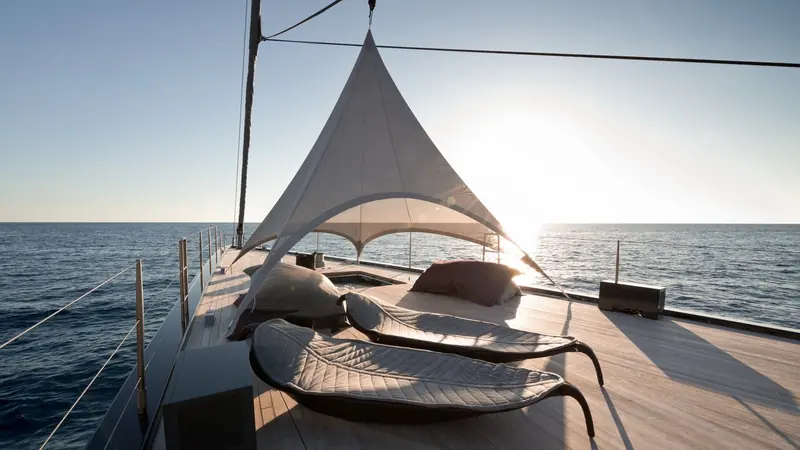 The cockpit shaded under its awning, the deck saloon and lounge seating that make Ngoni as much a cruising boat as a serious performer.
