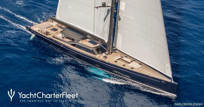 Nilaya close-hauled under mainsail and genoa, her black hull and pale teak deck the giveaway against the Featherlight yachts she is often confused with. Photo: Carlo Borlenghi.