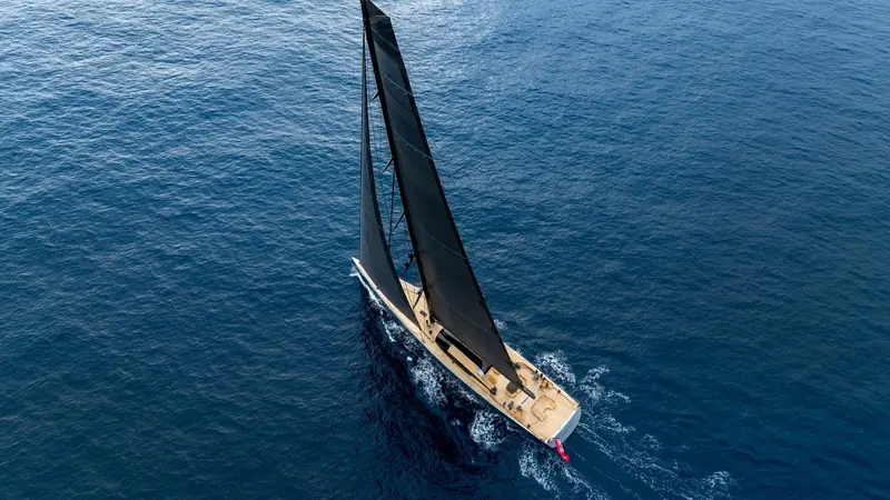 Sarissa close-hauled under full sail off the Balearics, her matte black hull and carbon superstructure barely breaking the teal water she is built to cut through fast.
