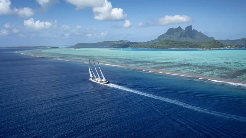The full atoll comes into view astern - Sea Eagle II's owners use exactly this kind of remote Pacific cruising ground the yacht was designed to reach and stay in for weeks unsupported.