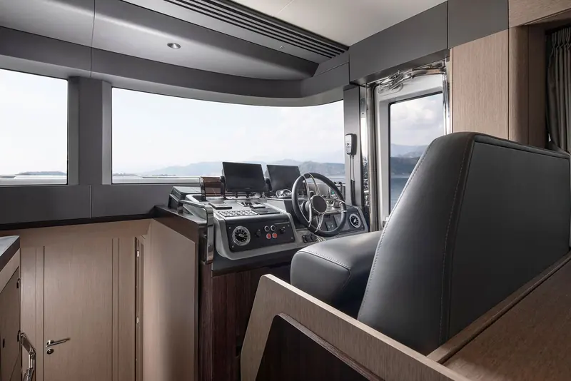 The helm station, twin armchair seats facing a console sized for a single main display and analogue backups.