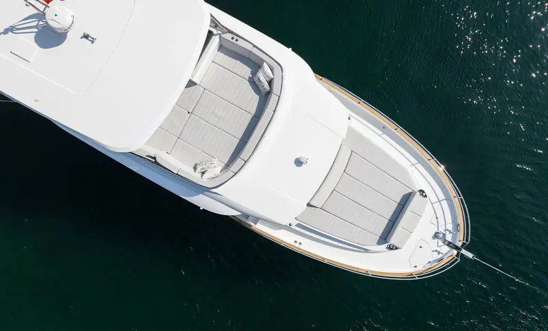Looking straight down on the foredeck, the sun pad and forward anchor locker sit ahead of the raised pilothouse windscreen.