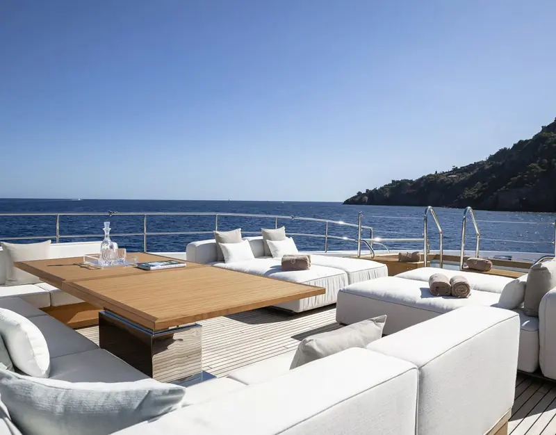 The sun deck dining and lounge area, laid out by Cassetta Yacht Designers, who drew both the exterior and interior of the line.