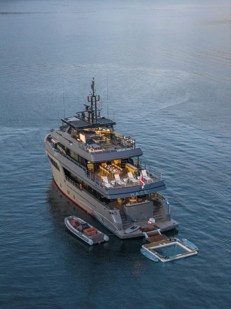 Haze2 at anchor, her tender lowered off the transom garage, the first Darwin 102 delivered since Atlas eight years earlier.