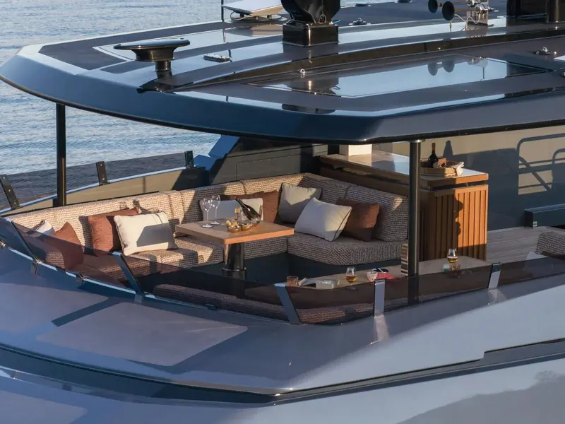 The sun deck's glazed roof retracts over the lounge, opening the highest deck to the sky without giving up shade on demand.