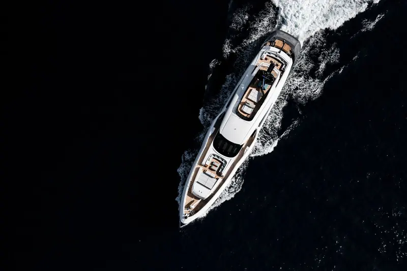 EIV at anchor as the sun sets, her grey semi-displacement hull built to the range Arrabito developed with Rossinavi.