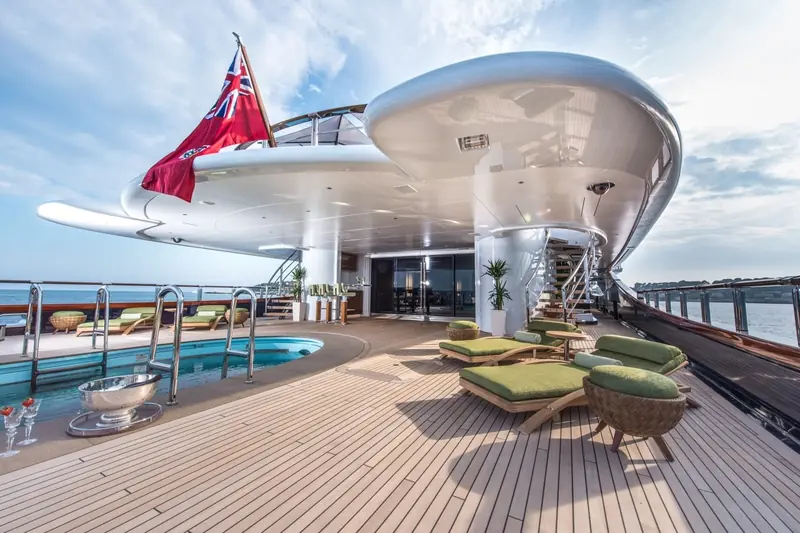 The pool deck beneath Nirvana's sweeping sky-lounge overhang, a structure whose weight and stability sit on Azure's naval architecture underneath Sorgiovanni's styling.