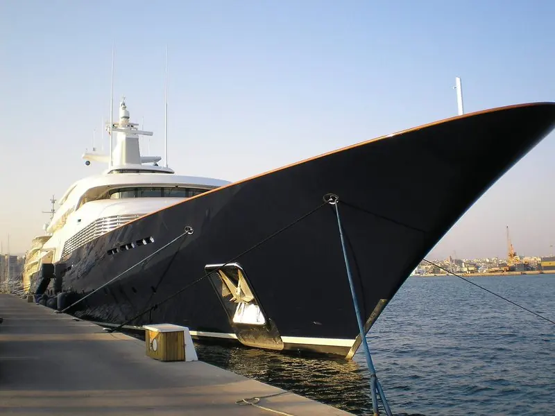 Limitless towers over the quay at Palma de Mallorca, her dark bow flared out above the mooring lines.