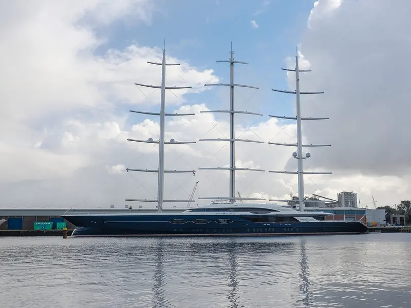 Black Pearl at her builder's yard, the three carbon DynaRig masts folded flat against a 106.7-metre hull that BMT Nigel Gee had to engineer to carry them under full sail as well as at anchor.