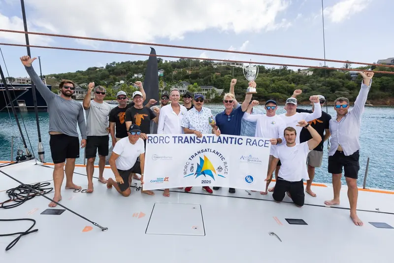 Raven's crew celebrate on deck after winning their class in the 2026 RORC Transatlantic Race.