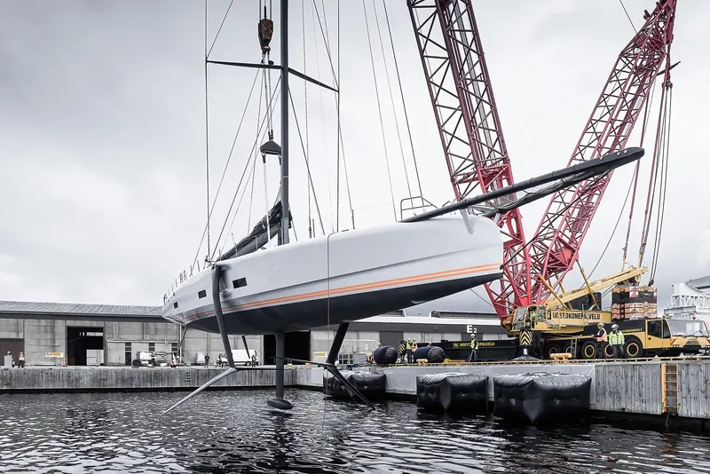 Raven is craned out at Baltic Yachts in Finland, her canting keel and rudders clear of the water.