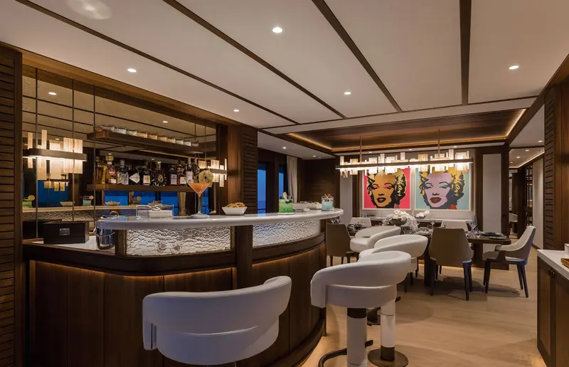 The main-deck bar and dining area aboard Solemates, fitted out in-house by Mulder and the owner's team inside the envelope Claydon Reeves drew for the exterior.