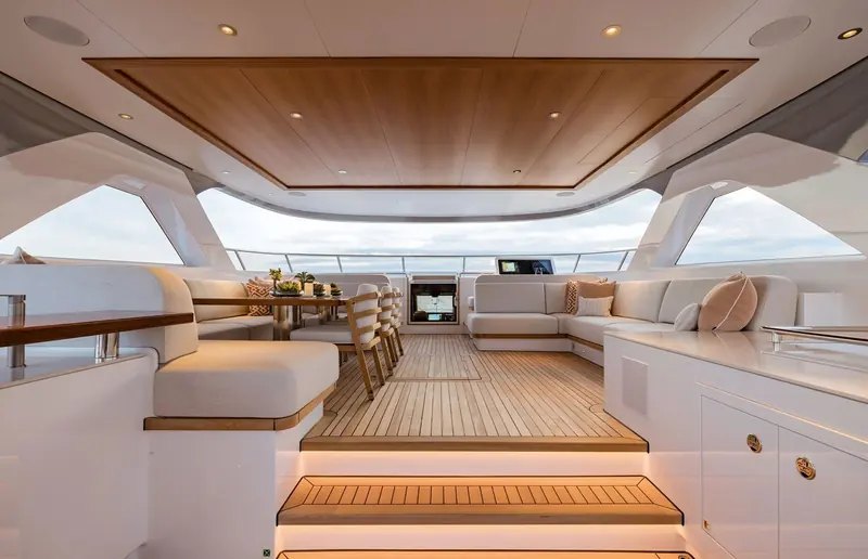 The upper saloon aboard Solemates, teak overhead and full-width glazing carried through from Claydon Reeves' exterior envelope into the interior fit-out.