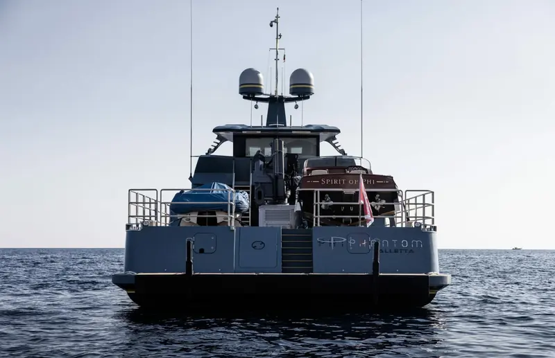 Phi Phantom's transom, with her own tender Spirit of Phi shipped aboard. Naval architect Perry van Oossanen worked with Cor D. Rover on both Phi and this support vessel.