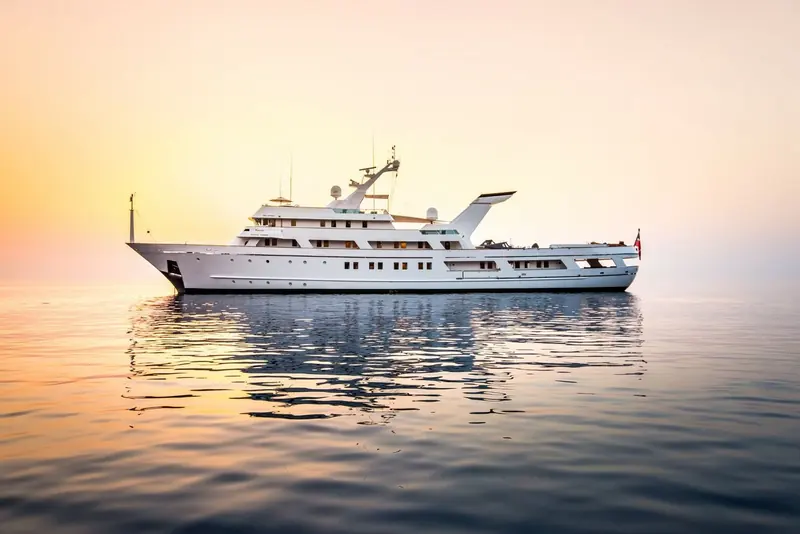 Esmeralda at rest on still water as the light fades to evening.