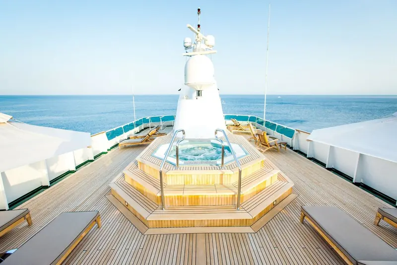 The foredeck spa pool and sun loungers aboard Esmeralda, teak decking running the length of the bow.