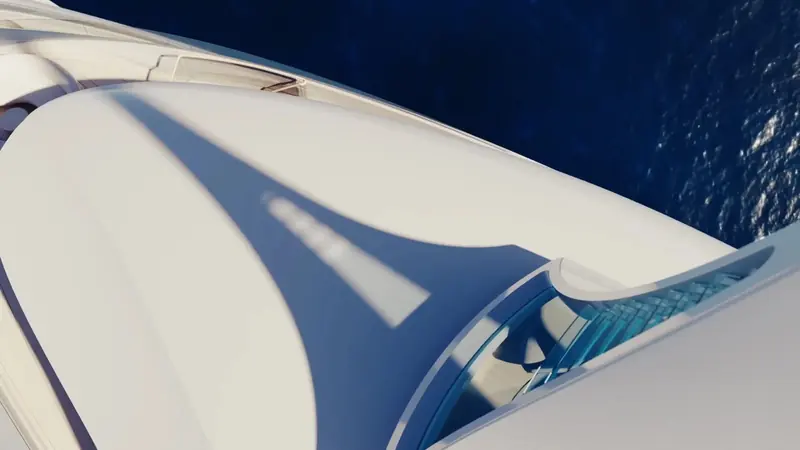 A Feadship sundeck hardtop seen from above, the sea running past close alongside - De Voogt's naval architecture puts the guest deck this low over the waterline by design, not accident.