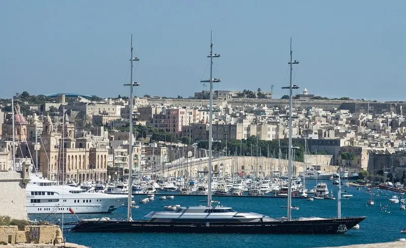 Maltese Falcon lies in the harbour at Valletta, Malta, under bare masts.