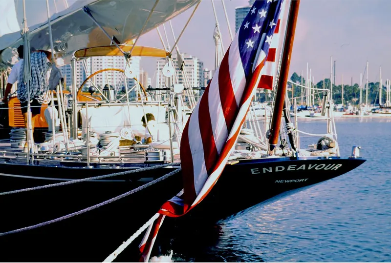 Endeavour at her berth, her name and Newport lettered on dark blue topsides.