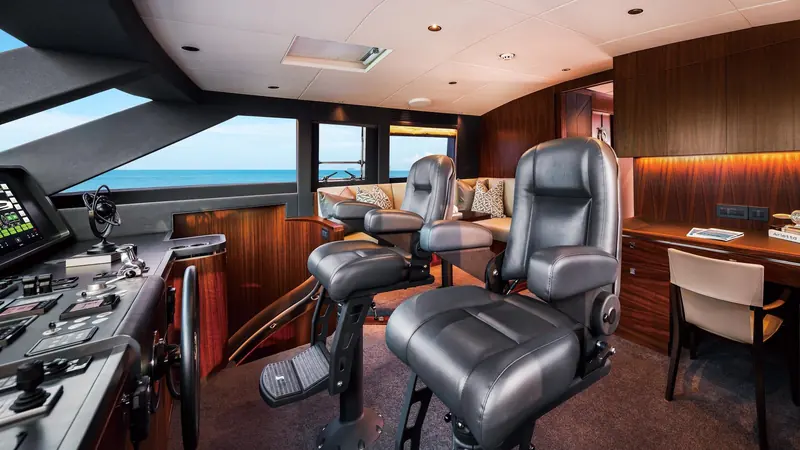 The raised pilothouse helm, twin captain's chairs and a starboard nav desk sharing the sightlines the RP series is named for.