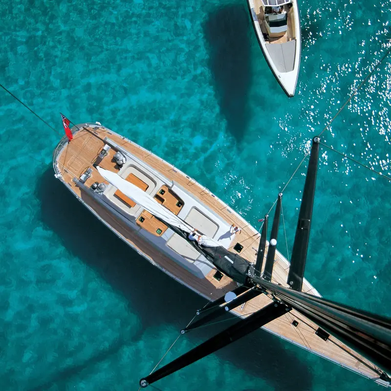 Dark Shadow, the 30.45m Wally sailing yacht with a Foster and Partners interior over German Frers naval architecture, at anchor with her boom cover furled.