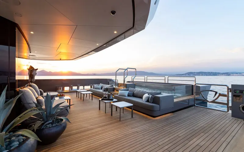 The aft deck of Panthalassa, the 56m Perini Navi ketch whose interior David Summerfield of Foster and Partners led from the project's inception, watching the sun go down.