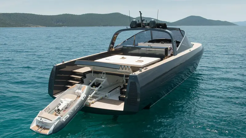 The Alen 68, Foster and Partners' 2014 collaboration with the Turkish builder Alen Yacht, shown with her tender launched from the transom garage.