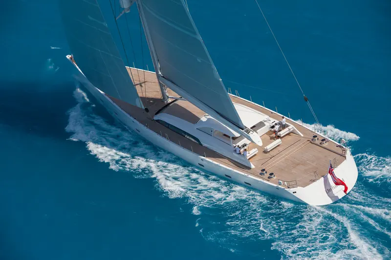 Unfurled's teak-laid foredeck and low-profile coachroof, photographed from the air off the wind. She won the World Superyacht Award for Sailing Yachts 45 metres and above in 2016 and took a class win at the St Barths Bucket the same year.